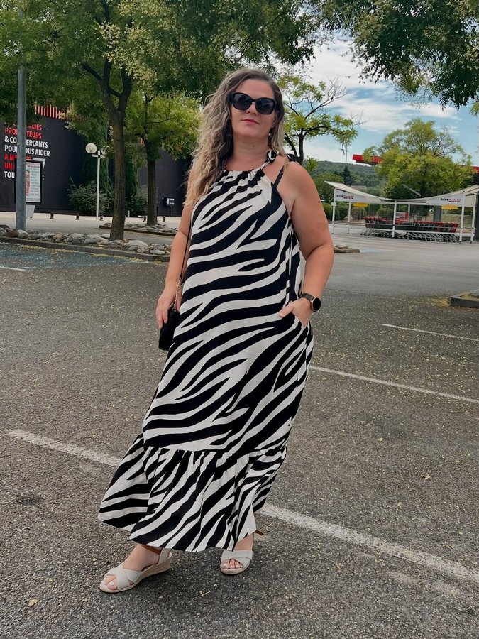 Instagram post by @era_lifestyle_ for Gini London. Caption reads: Outfit by @ginilondon 😍 Mono Zebra Print Tie....