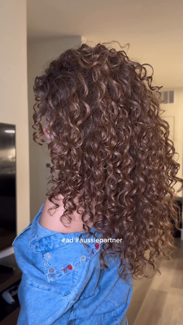 Instagram post by @curlyycamm for Aussie Hair. Caption reads: #ad� #aussiepartner� This routine with....