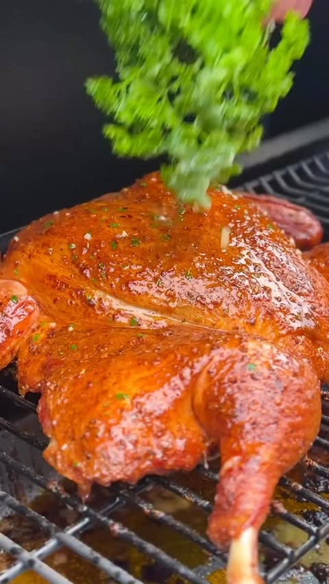 Instagram post by @thebkydpalate for Traeger Grills. Caption reads: Loaded Turkey Baked Potatoes on my Traeger 🔥 I....