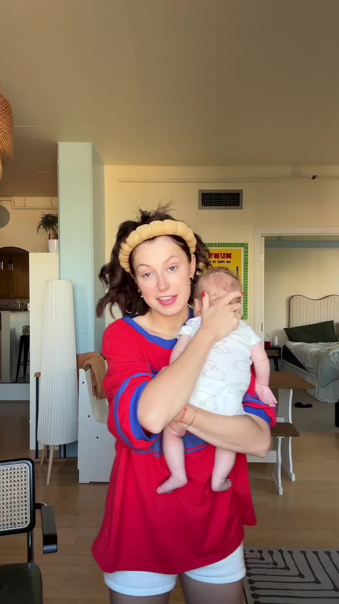 TikTok post by @lilybchapman for Baby Tula. Caption reads: catch us any and everywhere in our @Baby Tula ❤️....