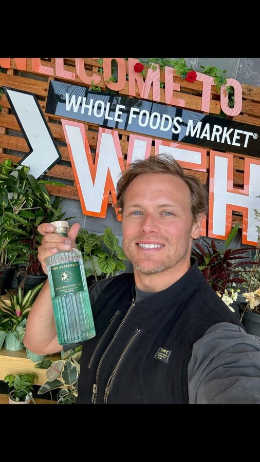 Instagram post by @samheughan for Sassenach Spirits. Caption reads: [...] #samheughan #sassenach #sassenachspirits....