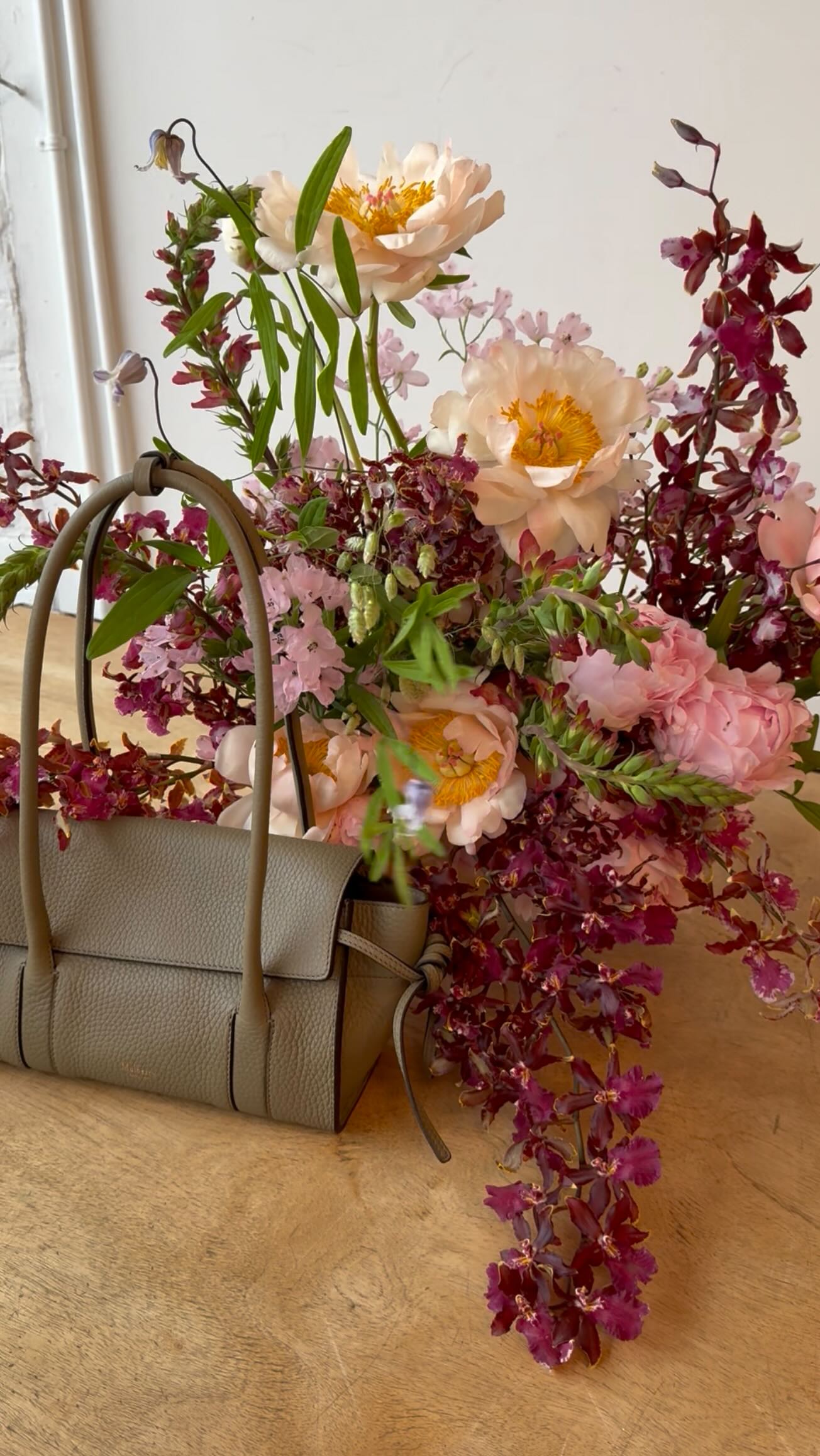 Instagram post by @flowersbyford for Mulberry. Caption reads: Market mornings and studio days with....