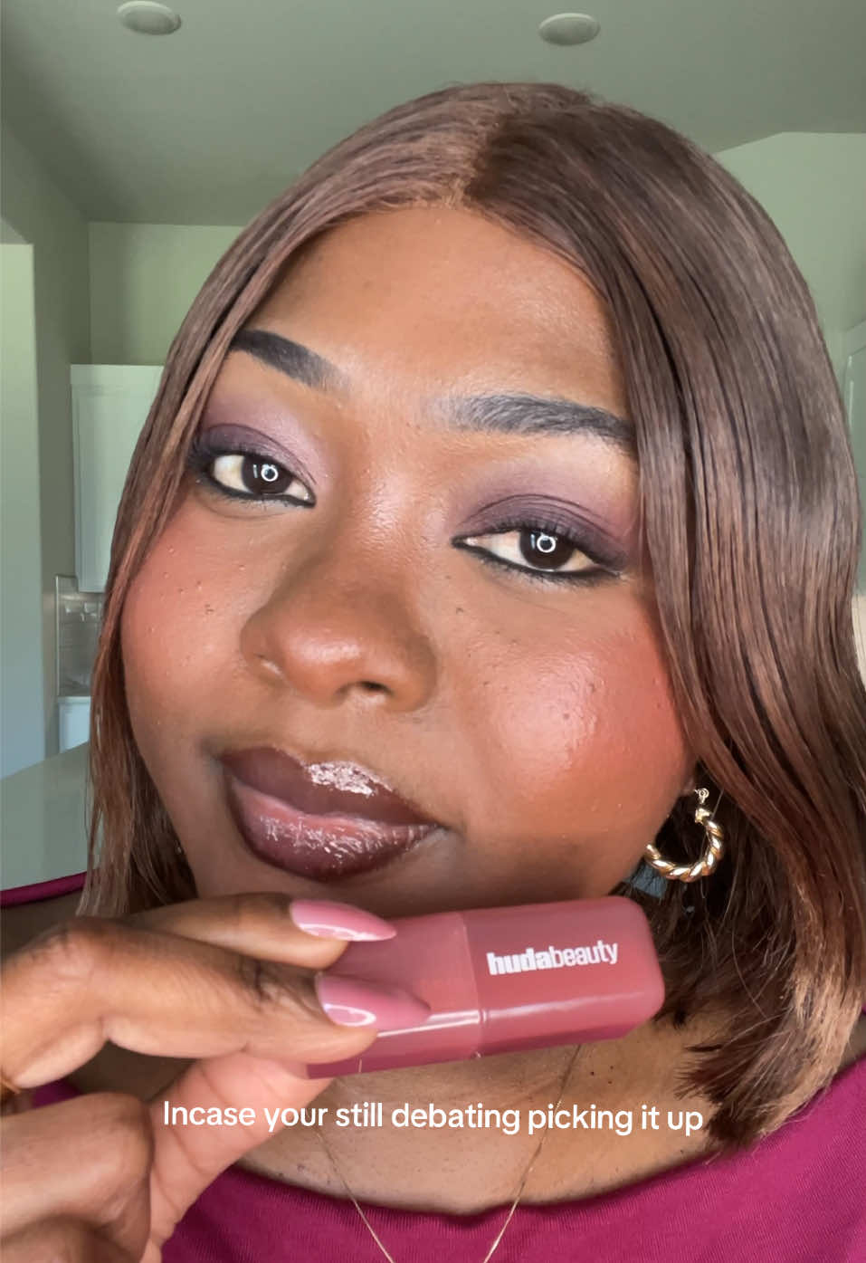 TikTok post by @breord0 for Huda Beauty. Caption reads: Obsessing over the new @Huda Beauty strawberry....