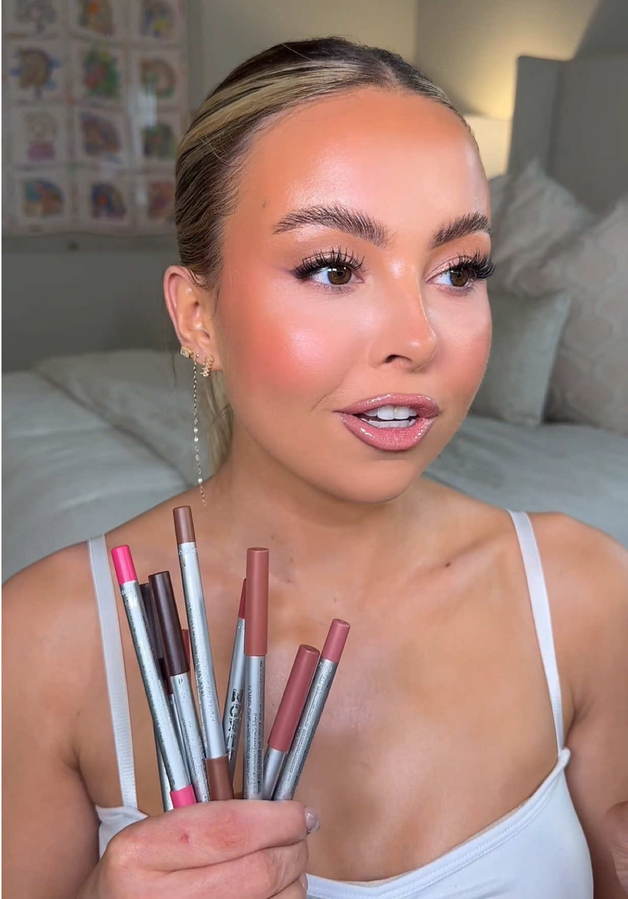 TikTok post by @mckennagoddard for BUXOM Cosmetics. Caption reads: [...] combo routine with the prettiest....