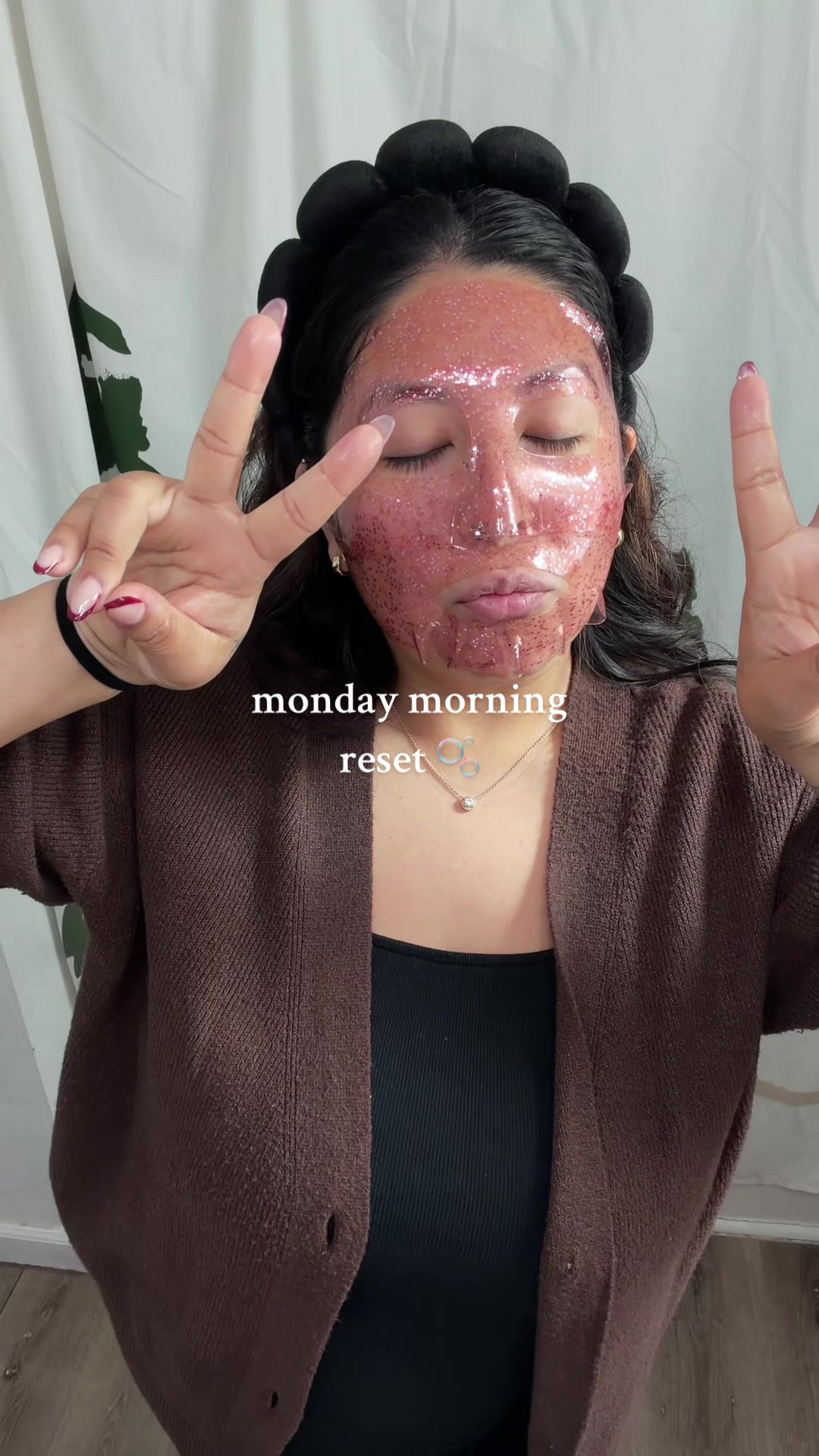 TikTok post by @lucypinones for LOOPS. Caption reads: wearing my LOOPS beauty face mask while getting....