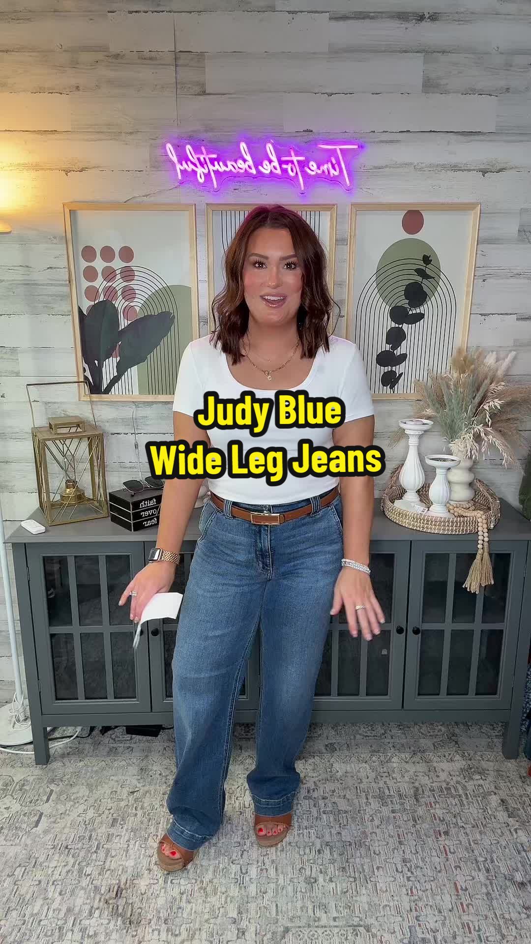 TikTok post by @katrinagmoore for Emma Lous Boutique. Caption reads: We love a good pair of wide leg jeans and these....