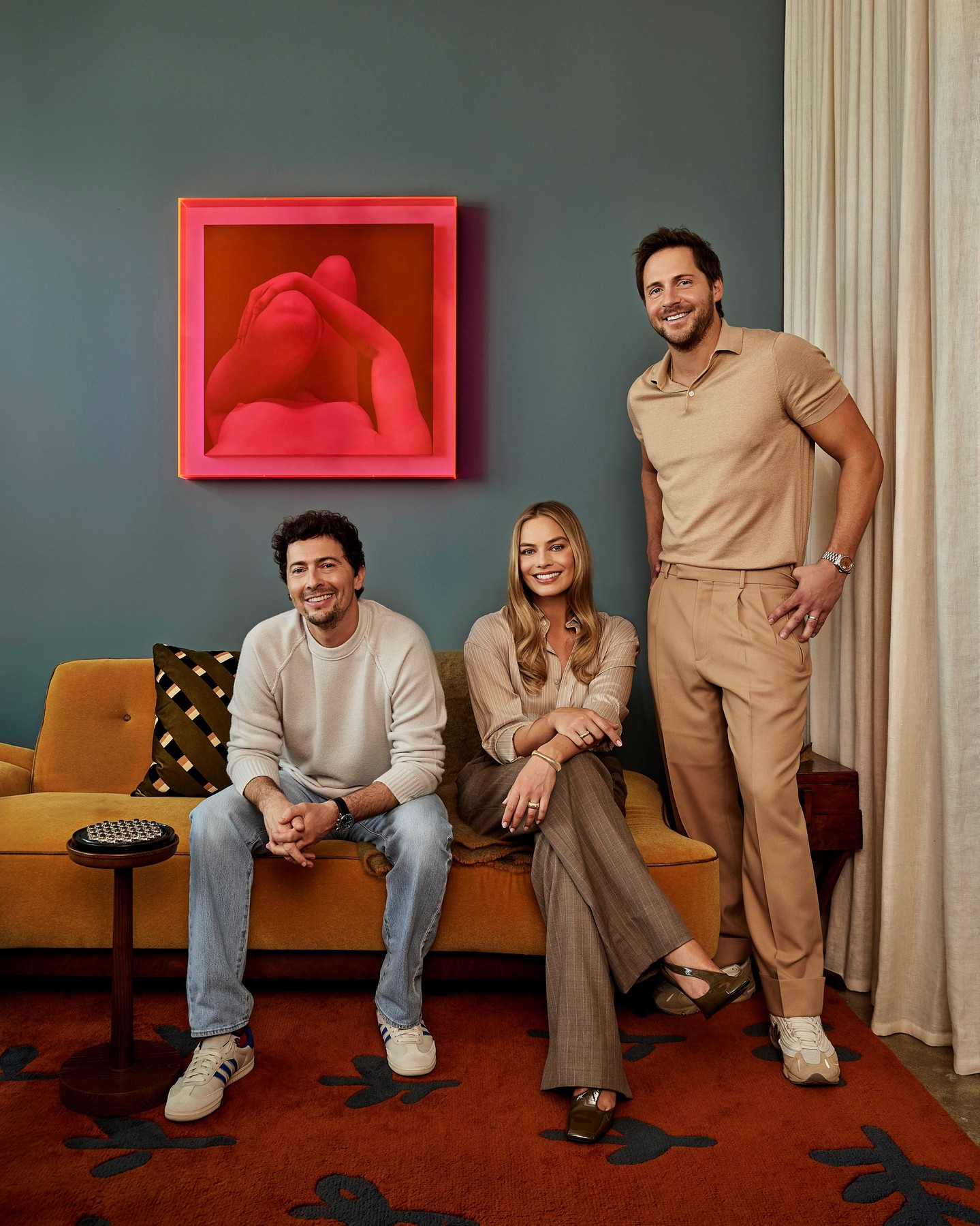 Instagram post by @luckychap for Architectural Digest. Caption reads: Cofounders of @luckychap Margot Robbie, Tom....