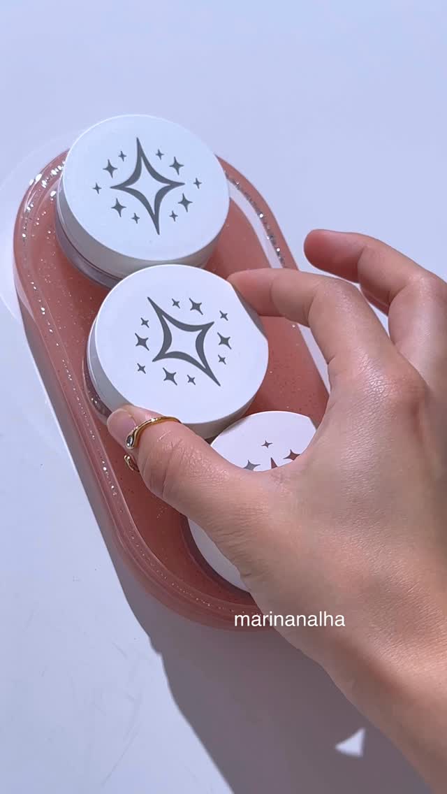 Instagram post by @marinanalha for Half Magic Beauty. Caption reads: New glitter puck shade??? 🤩✨

Glimmer pop is....