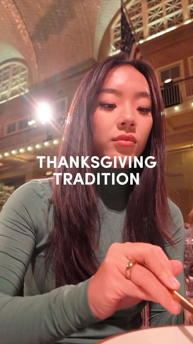 Instagram post by @eatingalonediaries for Max Mara. Caption reads: GRWM for a Thanksgiving feast on Ellis Island!!!....