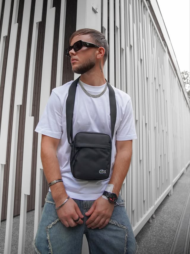 Instagram post by @eric_11e for Lacoste. Caption reads: Ootd @lacoste x @hypecultclub 💣 #mensfashion....