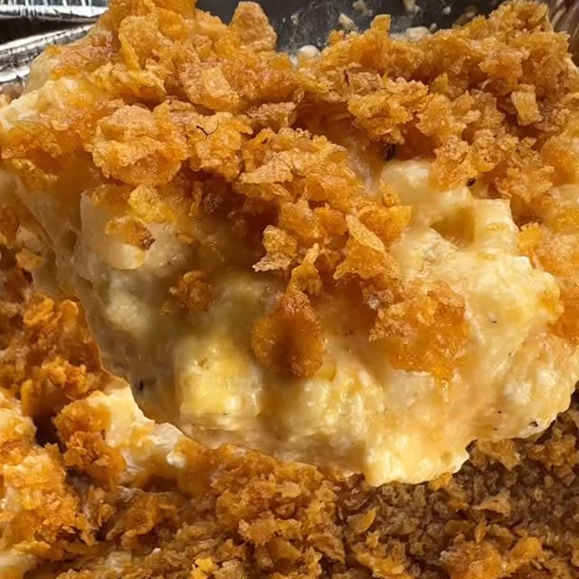 Instagram post by @cookinginthemidwest for Bear Mountain BBQ. Caption reads: #sponsored These Smoked Cheesy Funeral Potatoes....