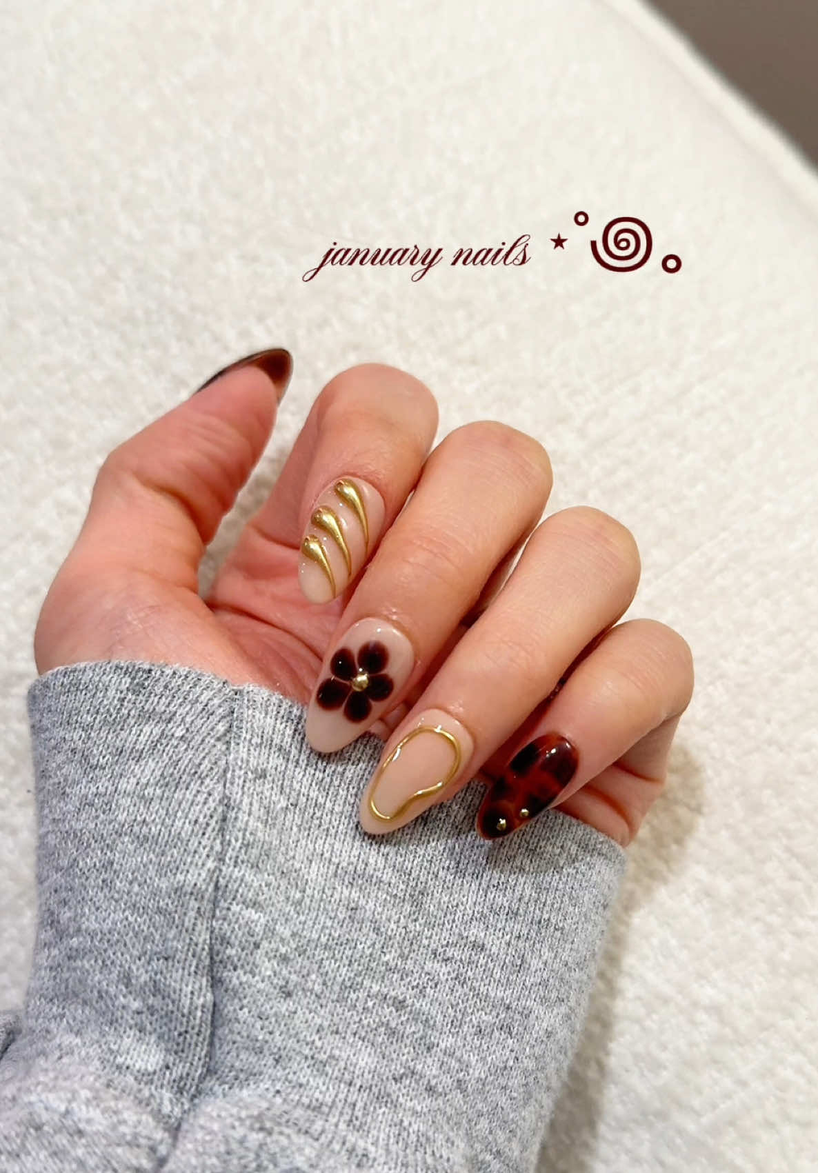 TikTok post by @strawberriezsnz for Ersa Nails. Caption reads: [...] January 🤎 i wanna see your nails!! @Ersa....