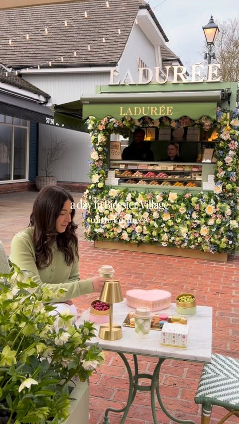 Instagram post by @prettylittlelondon for LADUREE PARIS OFFICIEL. Caption reads: ad A day in Bicester Village with @ladureeuk 🌸✨....