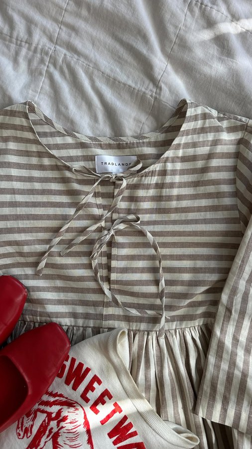 Instagram post by @mamanicoledavis for Tradlands. Caption reads: We love sustainably sourced dress… new colorway....