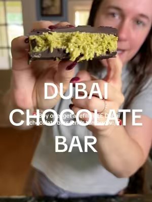 TikTok post by @justrachelv for CHOCBOX. Caption reads: [...] #dubaichocolatebar #pistachiochocolate....