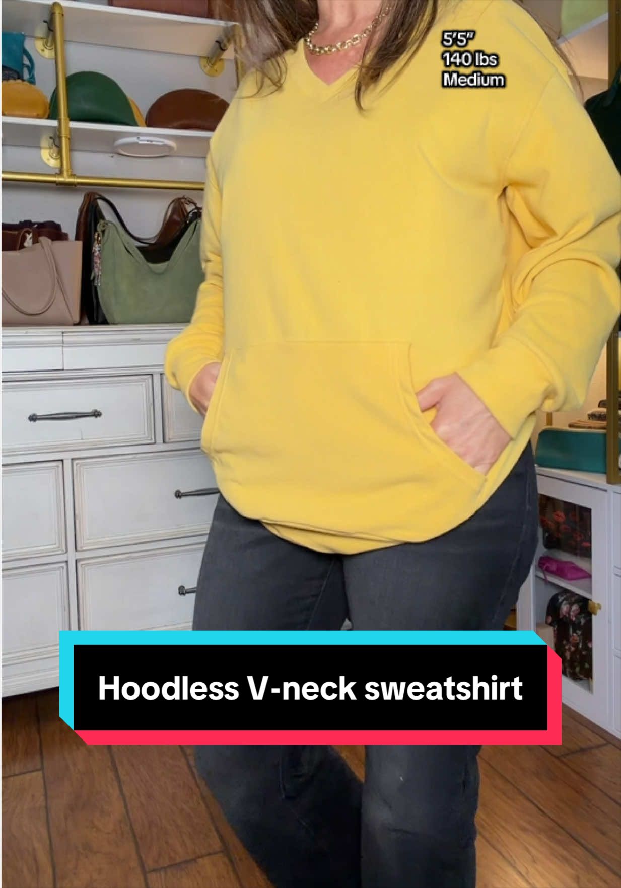 TikTok post by @kelliscroggins1 for AUSELILY. Caption reads: @AUSELILY #hoodlesshoodie #vnecksweatshirt [...].