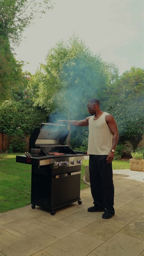 Instagram post by @wozldn for John Lewis & Partners. Caption reads: AD 100” screen, hybrid bbq, clean outfits. Elite....