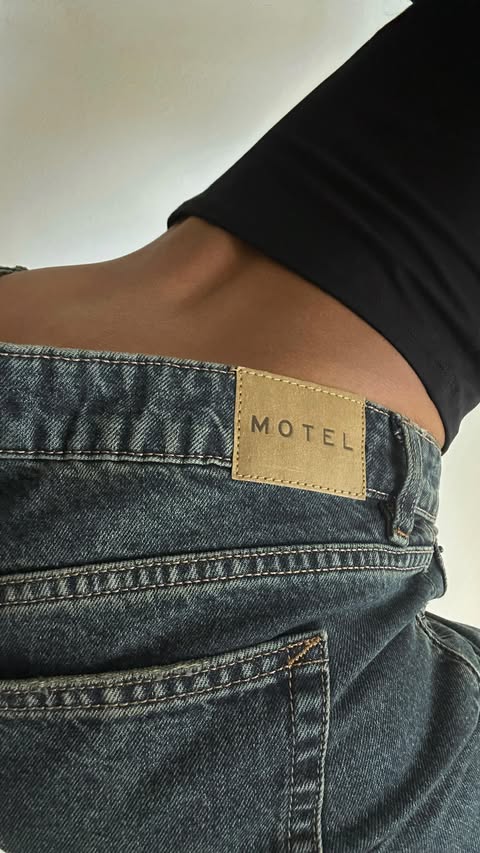 Instagram post by @sabrinamadison_ for MOTEL. Caption reads: 5’11” friendly low rise moment!! @motelrocks....