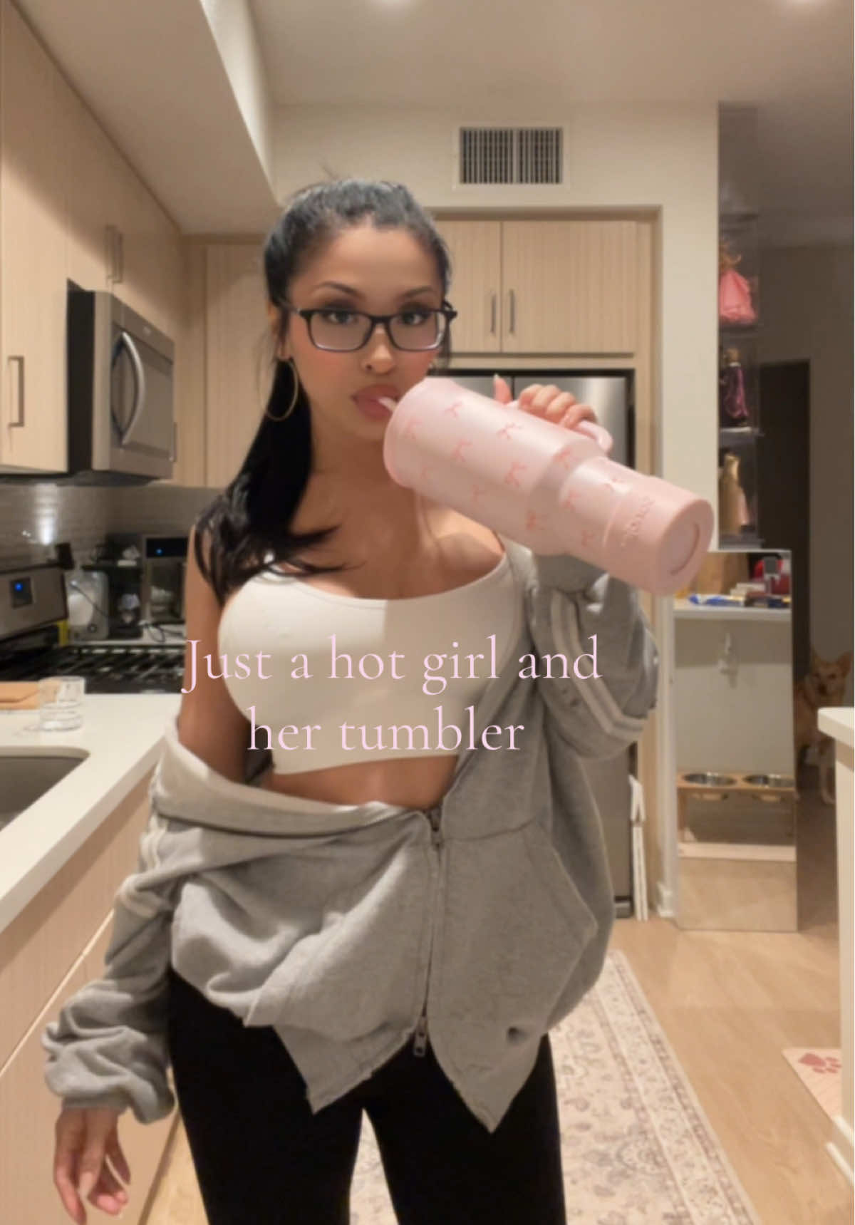 TikTok post by @elenagenevinne for Sandjest. Caption reads: [...] hydrated. #Fyp #ForYouPage #Tumbler....