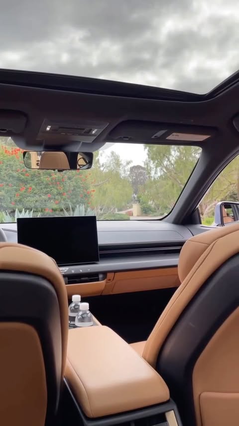 Instagram post by @adrienneshow for Lexus. Caption reads: the 2026 Lexus ES350e is fully electric, luxurious....