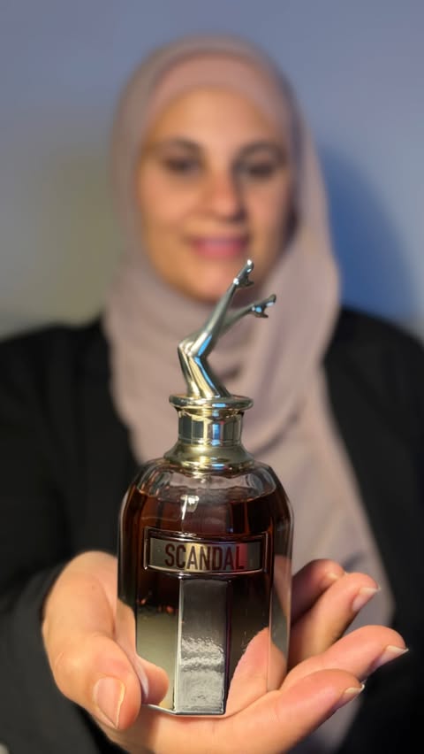 Instagram post by @lara_hawwash for Jean Paul Gaultier. Caption reads: [...] 😍 This Scandal Elixir by Jean Paul Gaultier....