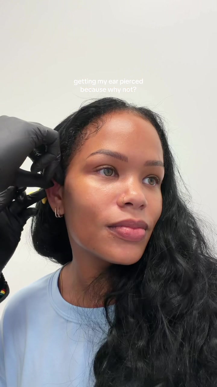 TikTok post by @arnellarmon for Studs. Caption reads: literally walked by @Studs👂Ear piercing &....