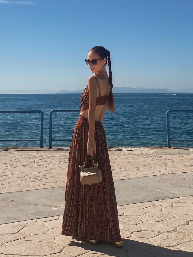 Instagram post by @marinabelize for Retro Stage. Caption reads: [...] between summer and forever ☀️🌊....