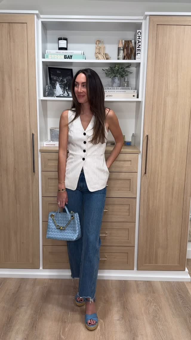 Instagram post by @liza.lieberman for STUART WEITZMAN. Caption reads: Spring has sprung and these denim sandals are the....