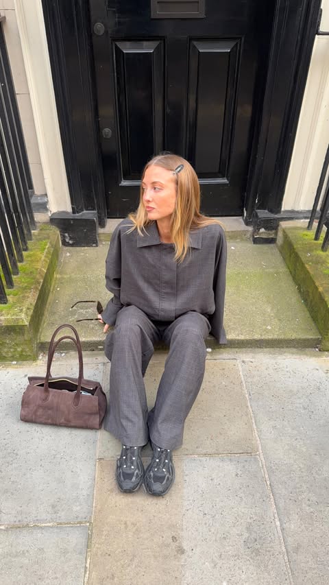 Instagram post by @sageybabey for DISSH. Caption reads: outfit of the day in London, wearing @dissh 🩶 AD.
