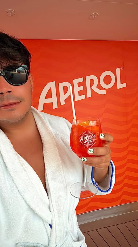Instagram post by @ginoleonardomascia for Aperol Spritz. Caption reads: [...] a bordo di Costa Toscana 🍹....