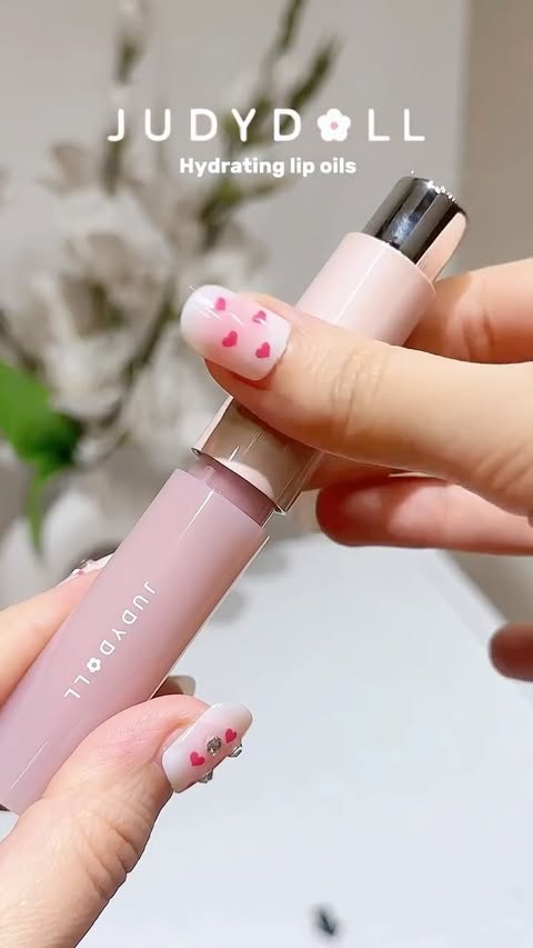 Instagram post by @glowupwithmufi for Judydoll. Caption reads: @judydoll_us Hydrating lip oils in shade 01,02....