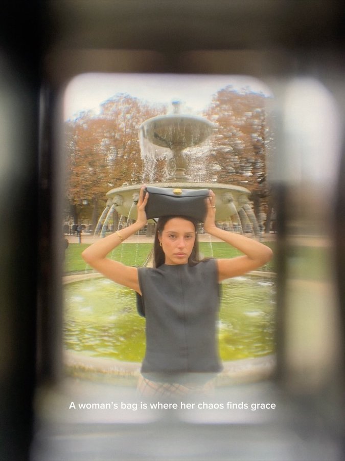 Instagram post by @maina for AMI Paris. Caption reads: [...] my world in my Carrousel bag 💌 @amiparis....