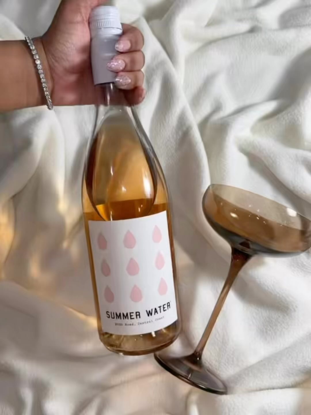 Instagram post by @chanbabyy for Summer Water. Caption reads: Wine down with @summerwater. 
.
.
#summerwater #AD....