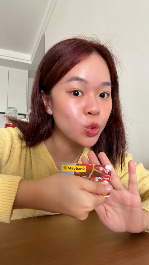 Instagram post by @jenjen_jengg for Malayan Banking Berhad (Maybank). Caption reads: Save. Debit. Win Your Dream Vacation. 💛....