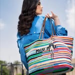 Instagram post by @lailaahmedzaher for Miu Miu. Caption reads: @miumiu ✨🧚🏼‍♀️.