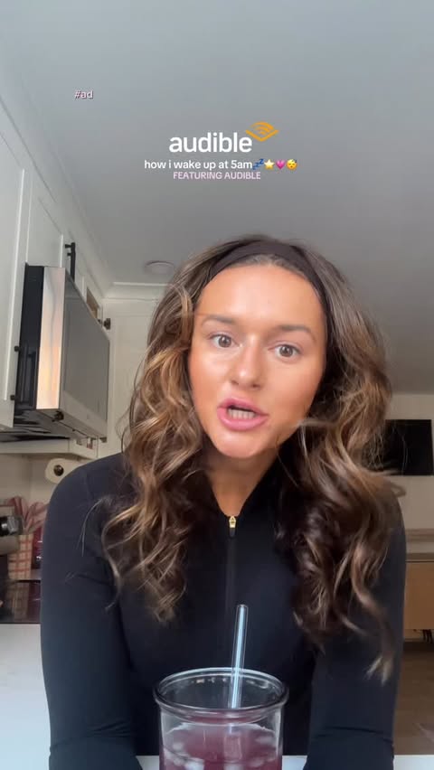 Instagram post by @julielawfit for Audible. Caption reads: I wake up at 5am to workout, thanks to @audible !!....