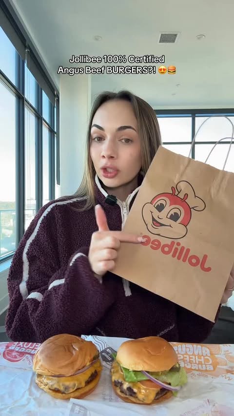 Instagram post by @laneygrn.eats for Jollibee US. Caption reads: Jollibee is now offering 100% Certified Angus Beef....