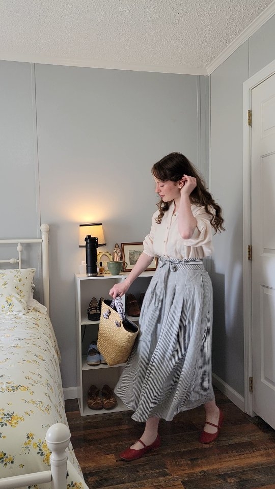 Instagram post by @modestyandfemininity for Simple Retro. Caption reads: Styling this cotton striped skirt from....