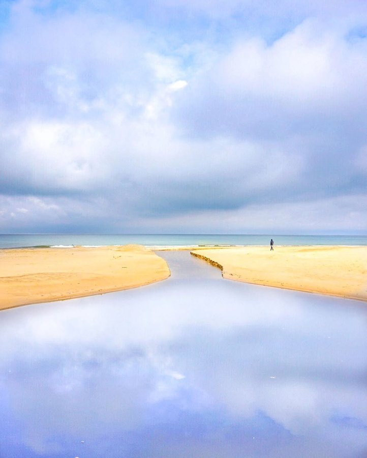 Instagram post by @lukekellytravels for National Geographic Travel. Caption reads: Sand and solitude. Indiana Dunes spans 15 miles of....