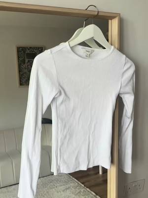 TikTok post by @vlada_reina for Social Tip. Caption reads: [...] look. You need this top in your life!....
