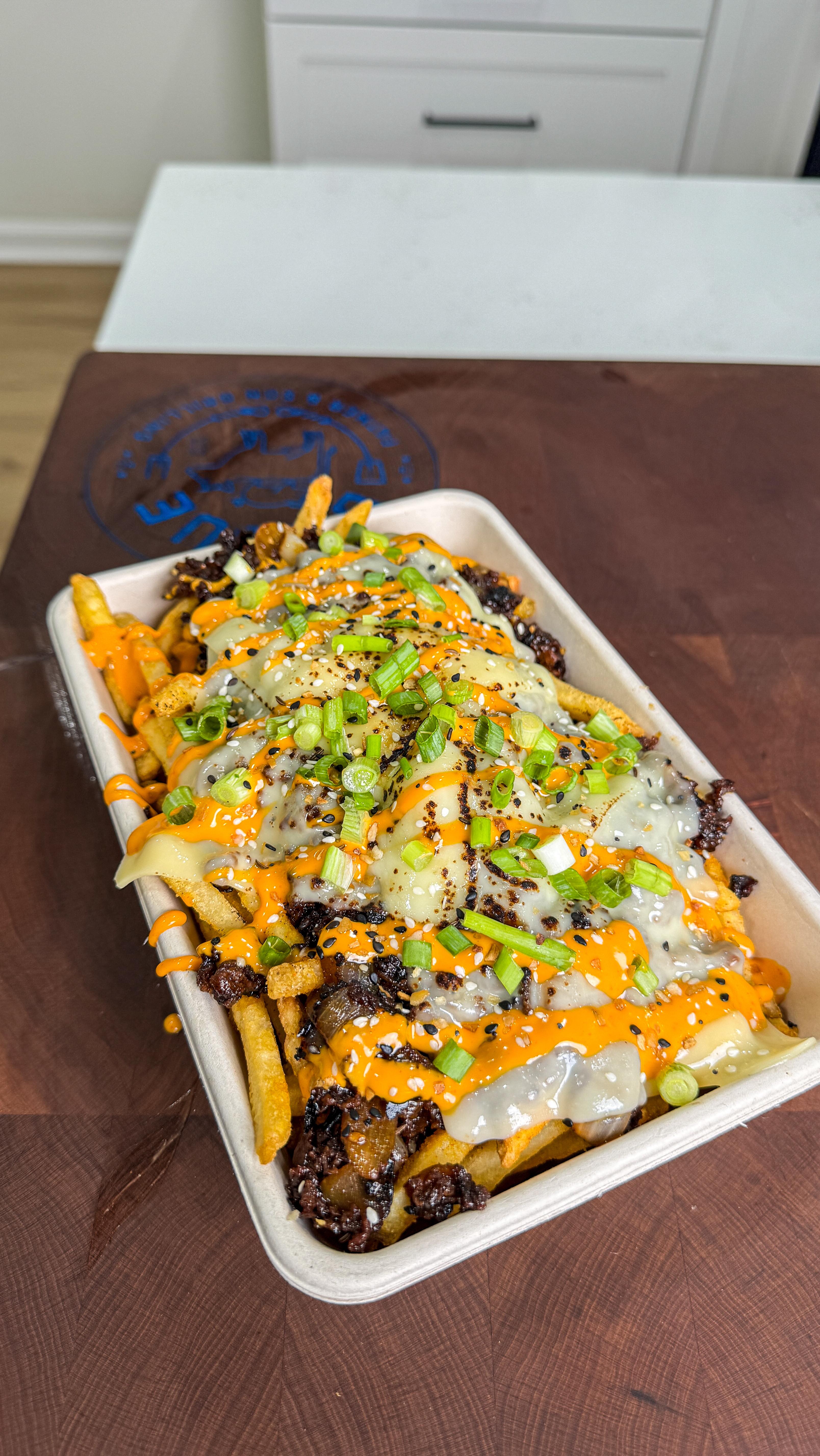 Instagram post by @g_bque for Kingsford. Caption reads: Bulgogi Cheesesteak Fries. These were so....