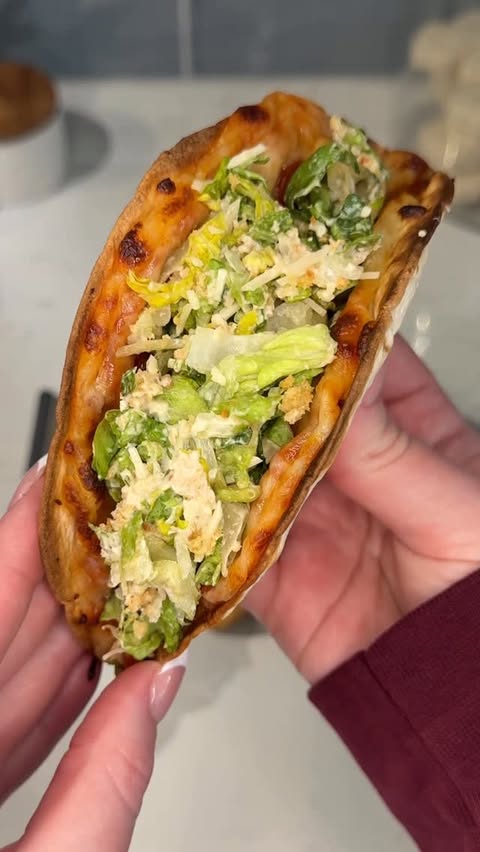 Instagram post by @ashleymarkleeats for Taylor Farms. Caption reads: [...] 🥗🍕 Ingredients: @yourtaylorfarms protein....