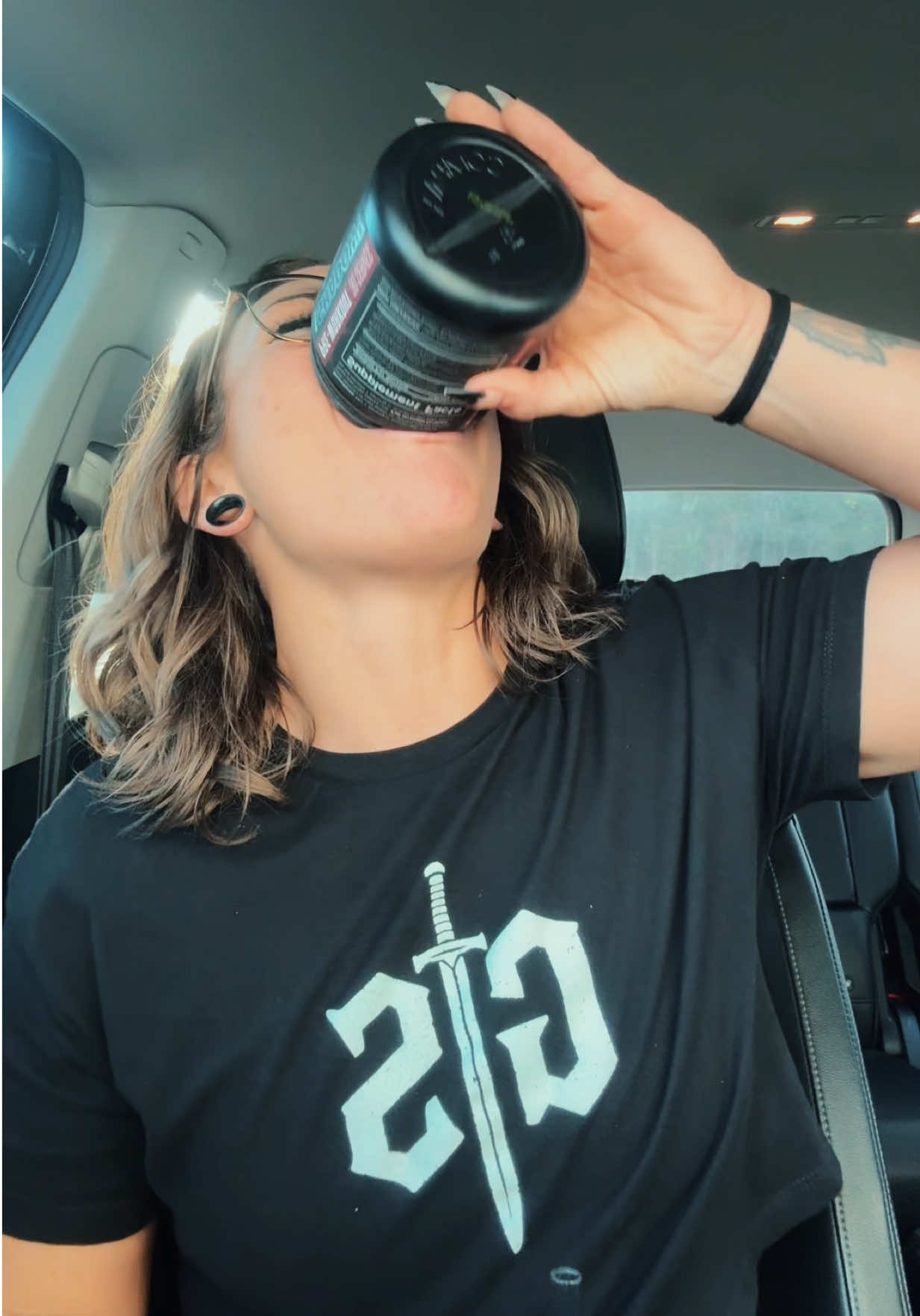 TikTok post by @laurabmullis for JNX Sports. Caption reads: [...] lol. #sponsored #EmbraceTheDarkness....