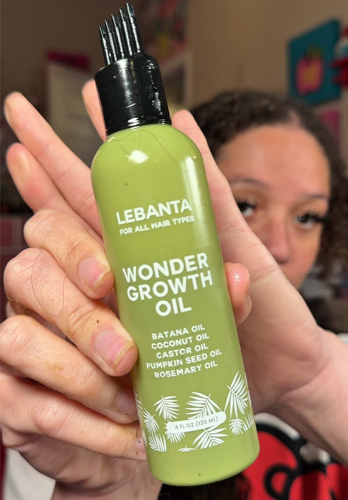 TikTok post by @brandi.reviews for Lebanta Haircare. Caption reads: @Lebanta Haircare #lebanta #batanaoil [...].