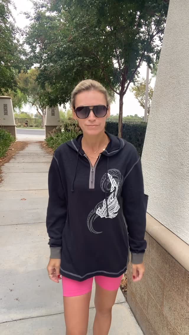 Instagram post by @mommakez3 for Crazy Shirts. Caption reads: Loving this Flow of Mana long sleeve hooded tee —....