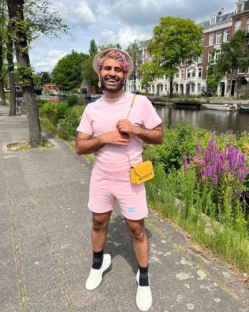 Instagram post by @alokvmenon for Toms. Caption reads: Day off from tour vibes in Amsterdam! Wearing the....
