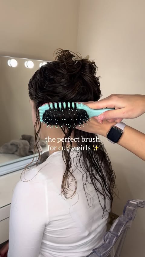 Instagram post by @beauty_and_curls_bymeg for BounceCurl. Caption reads: For those that love to brush style using the....
