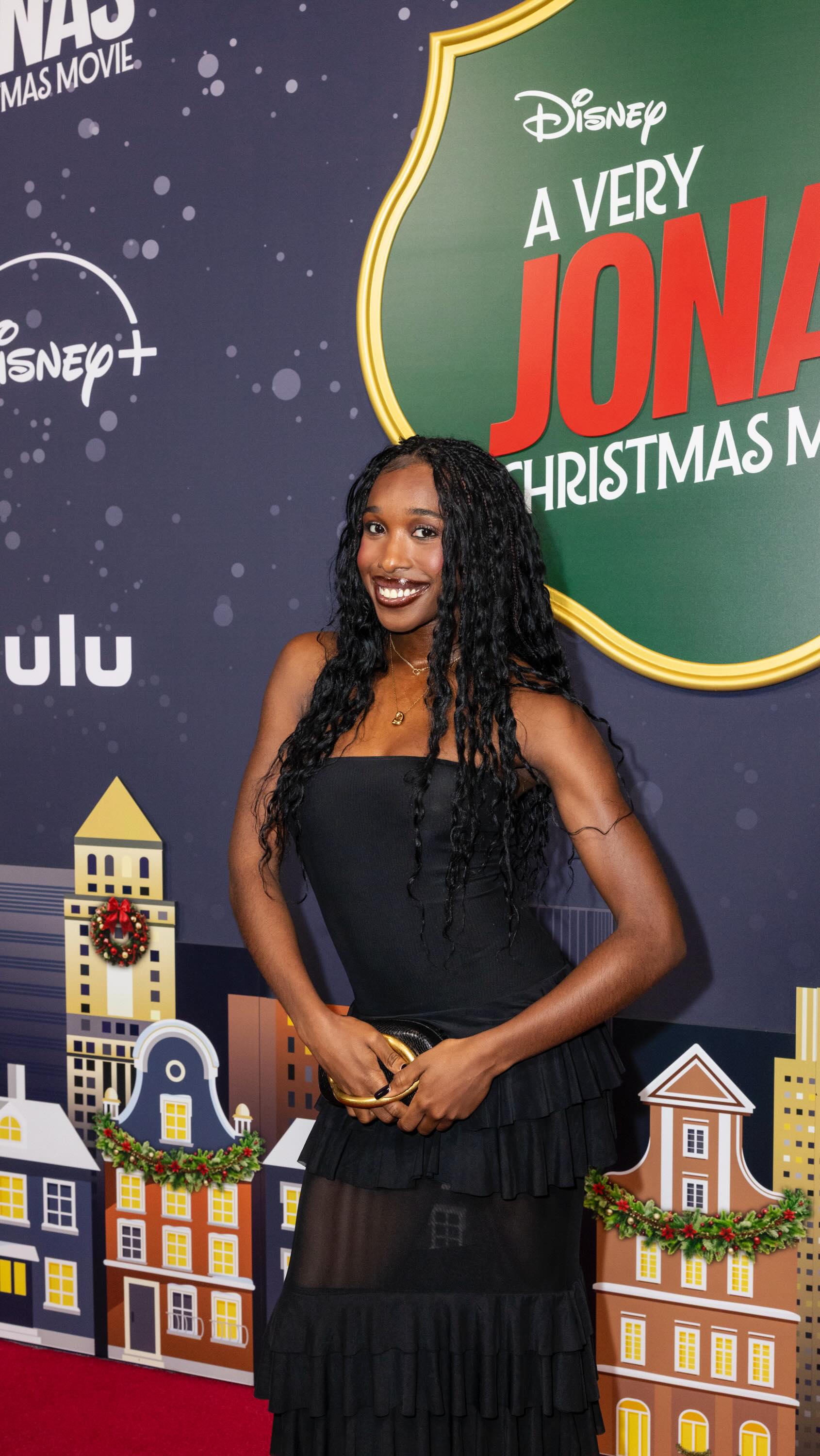 Instagram post by @danessyauguste for REVOLVE. Caption reads: I wore this to a Jonas brothers movie Premiere....