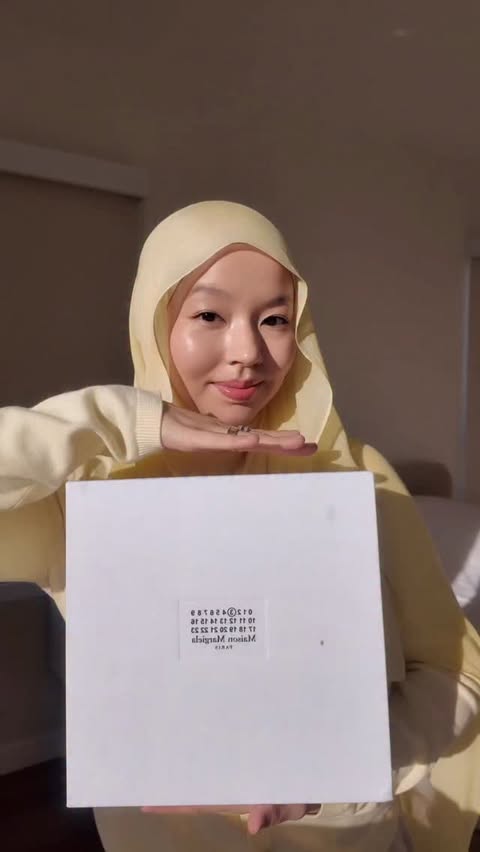 Instagram post by @cozuaizada for Maison Margiela. Caption reads: Unboxing a dream ✨ This Maison Margiela Replica....