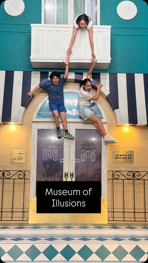 Instagram post by @the.real.la.mama for Museum of Illusions. Caption reads: @museumofillusions_usa has arrived to 3rd St....